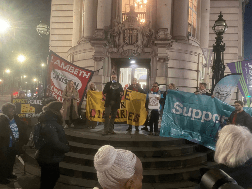 Photos of the protest held at Lambeth Town Hall with different speakers and banners